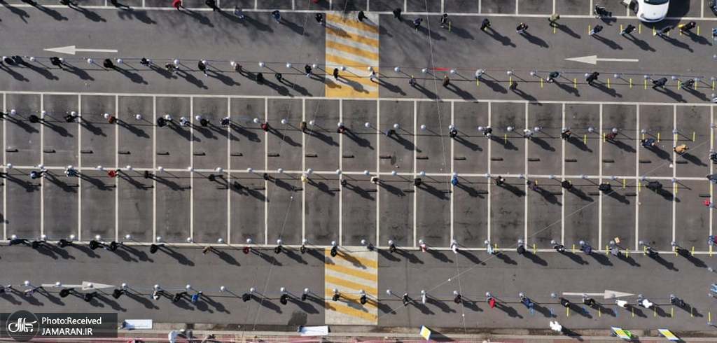 صف کارگران مهاجر برای انجام تست ویروس کرونا در سئول + عکس