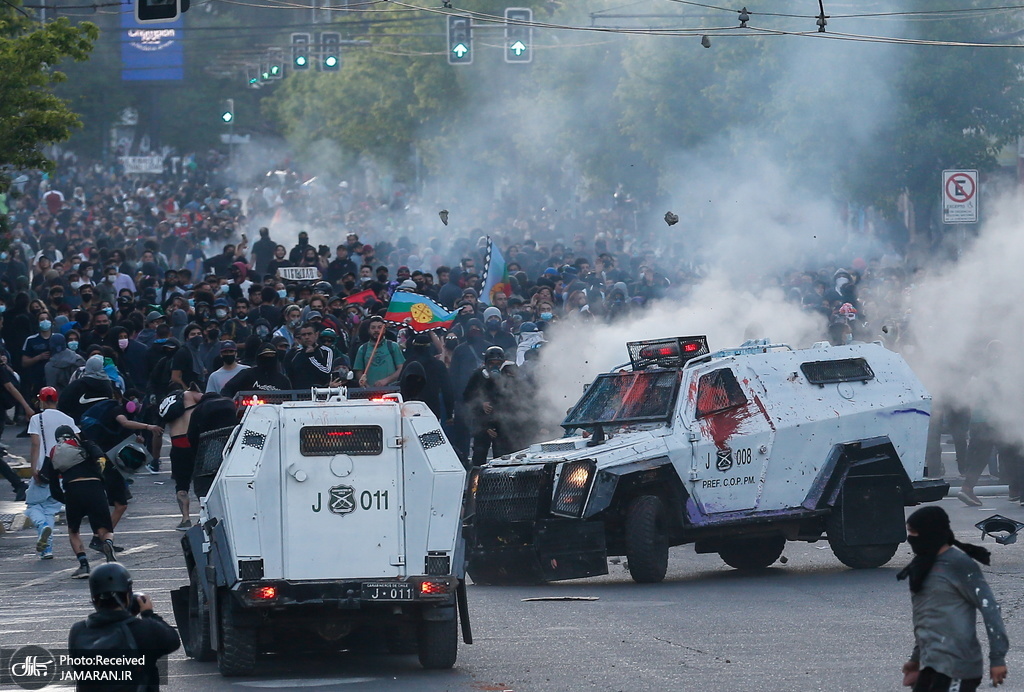 درگیری خونین مردم با پلیس ضد شورش شیلی + عکس