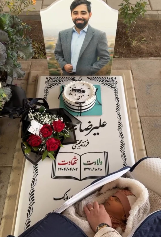 تصویری از شهید علیرضا تنابنده و پسر تازه متولد شده‌اش