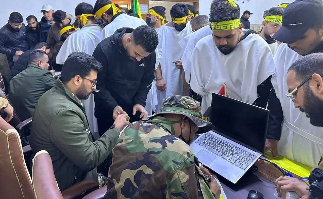 ثبت‌نام نیروهای مقاومت عراق برای دفاع از ایران+ عکس